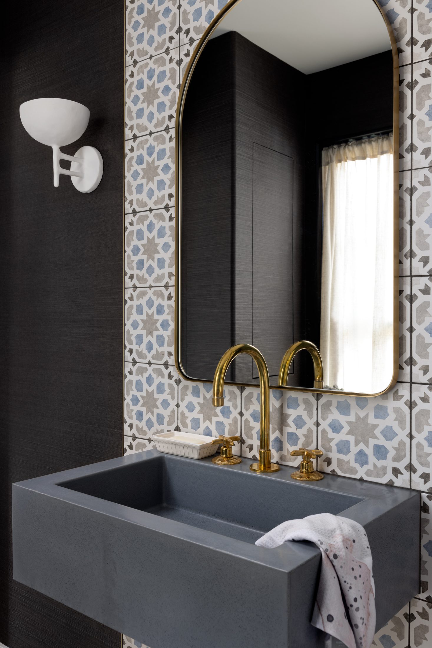 Vision in The Village — powder bath with patterned tile and brass