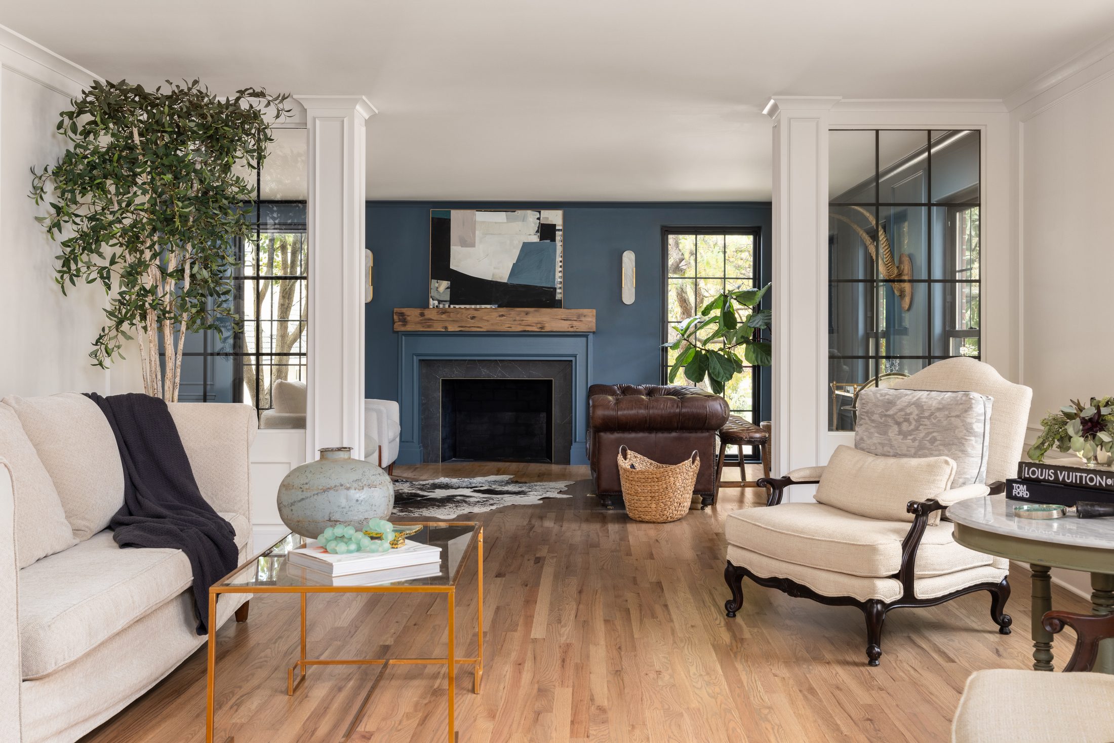 Vision in The Village — living room with blue fireplace wall